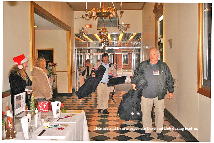 50_Heather and Laurie supervise Dave and Bob during load-in.